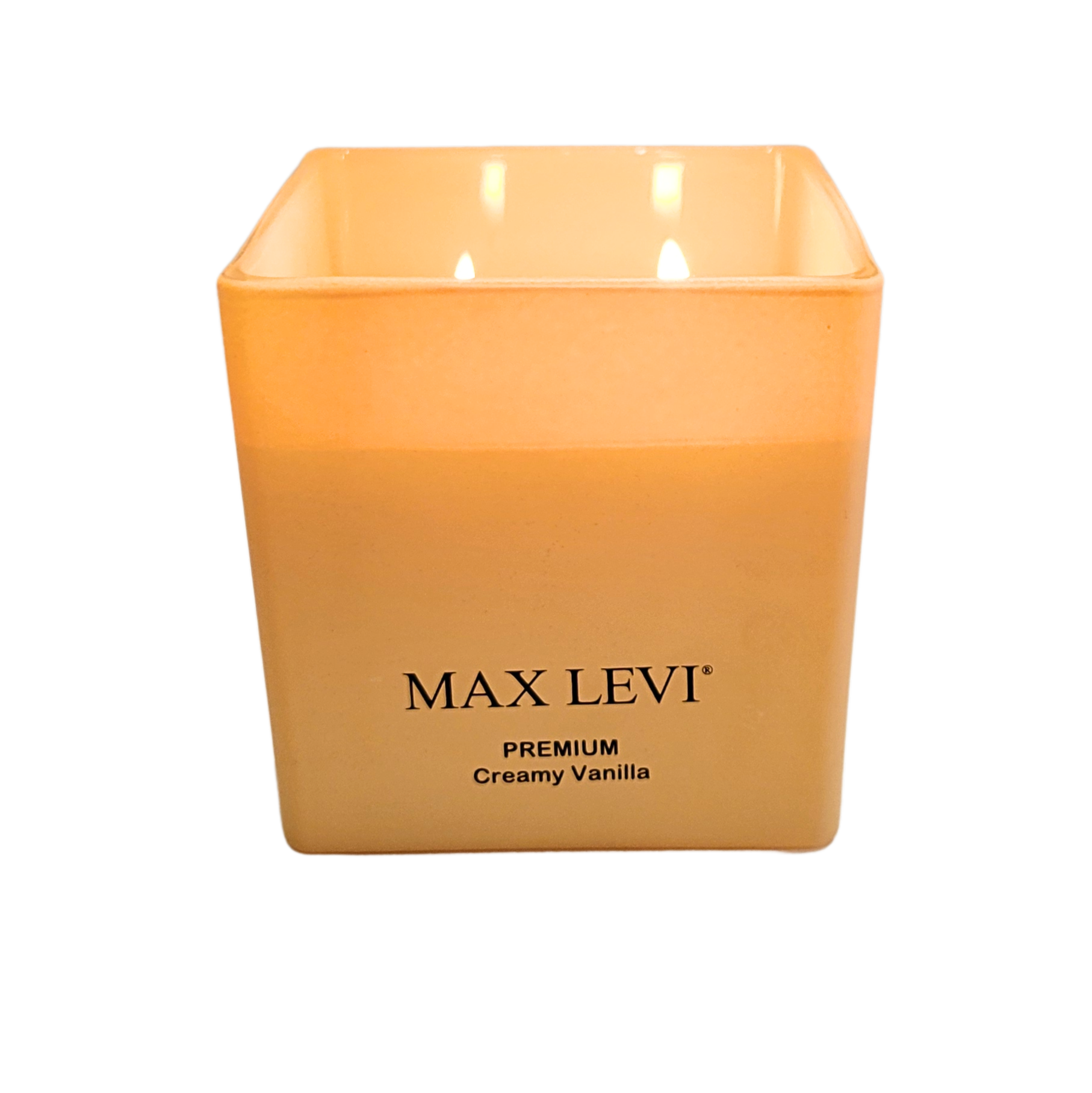 Max Levi Premium Creamy Vanilla Candle lit up, low angle view.