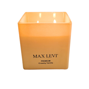 Max Levi Premium Creamy Vanilla Candle lit up, low angle view.