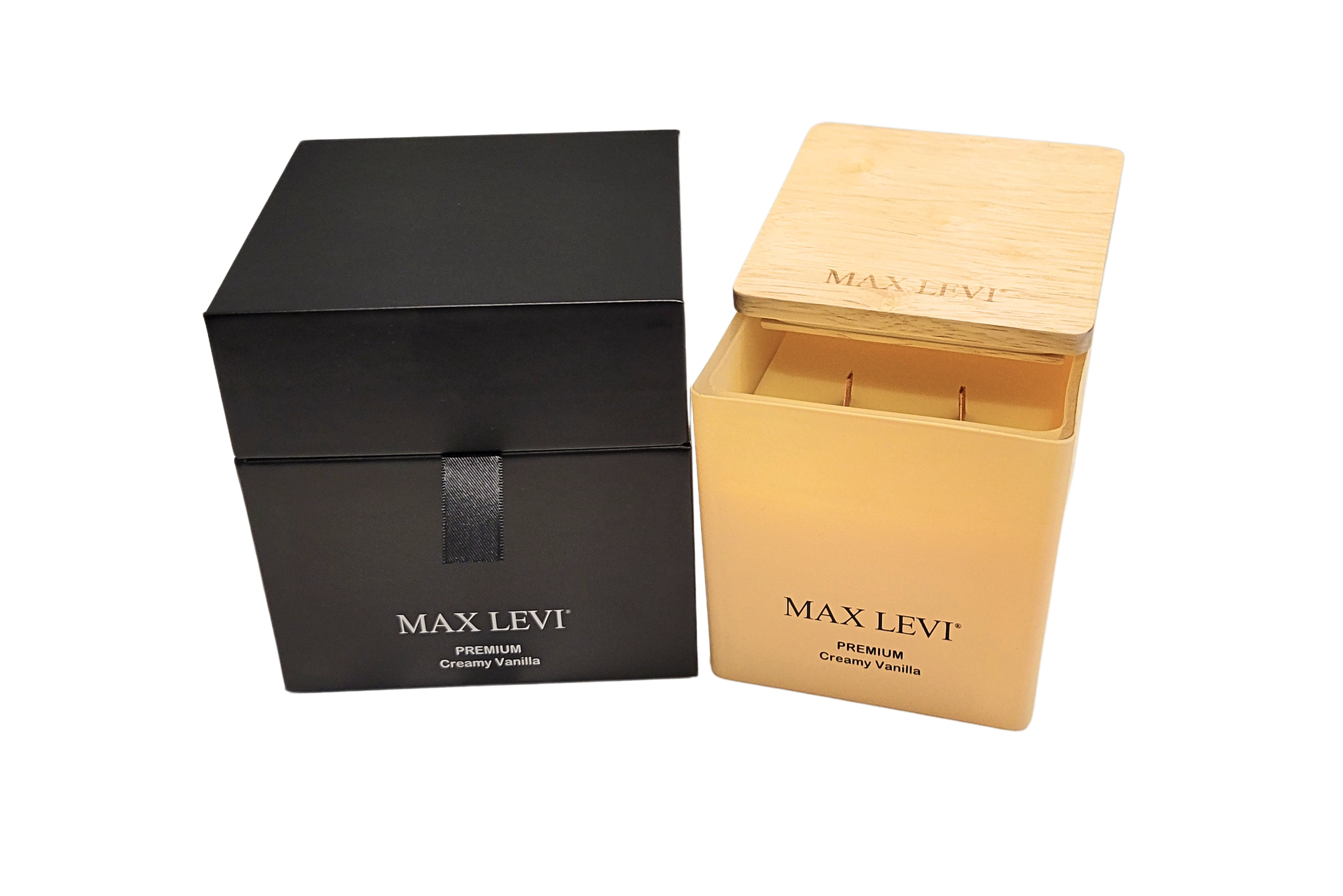 Max Levi Premium Creamy Vanilla Candle outside box beside gift box with lid half open.